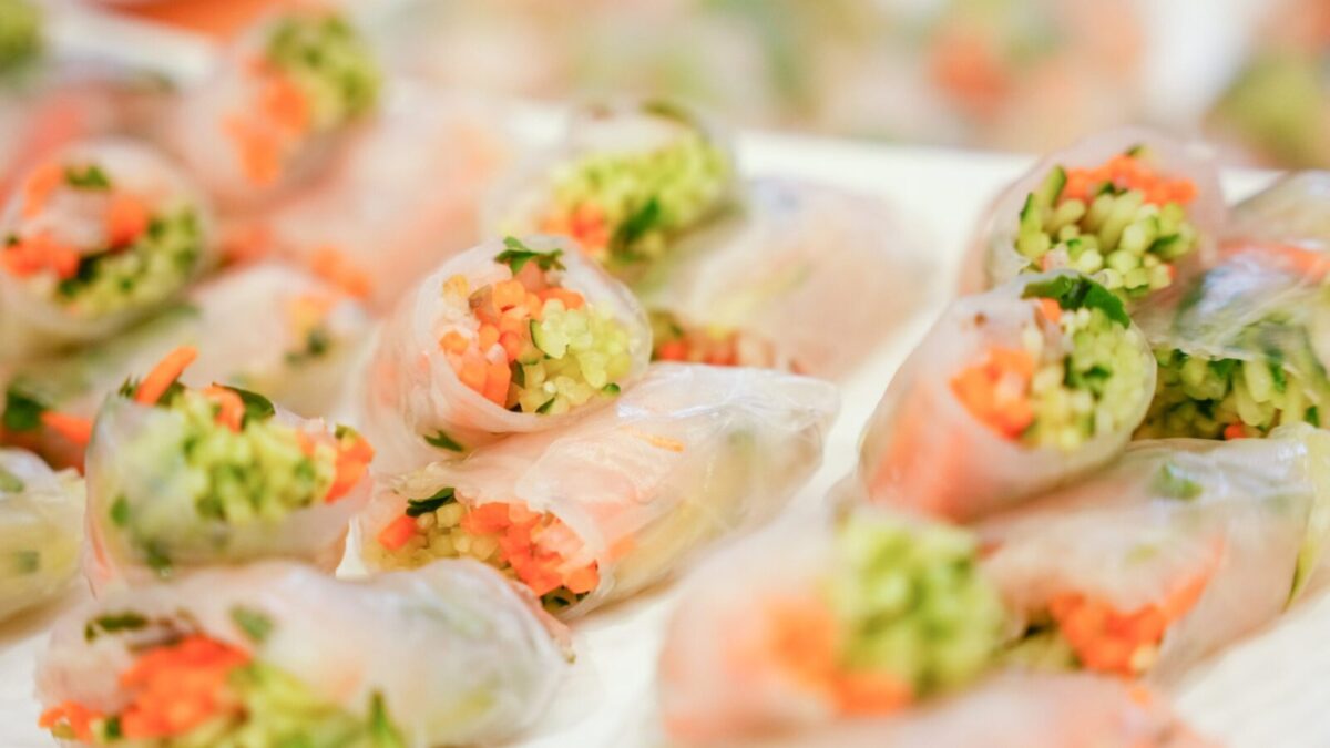 Close-up of colorful vegetable spring rolls wrapped in rice paper, perfect for a healthy snack.