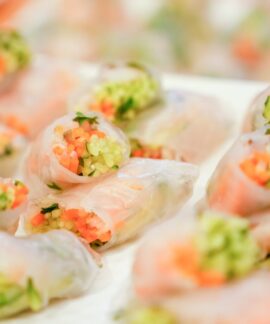 Close-up of colorful vegetable spring rolls wrapped in rice paper, perfect for a healthy snack.