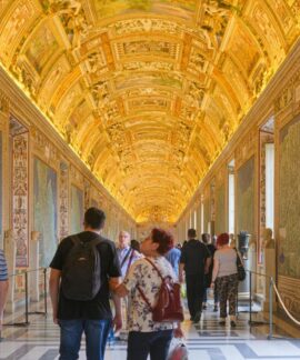 Explore the ornate and golden ceilings of the Vatican Museums filled with art and history.