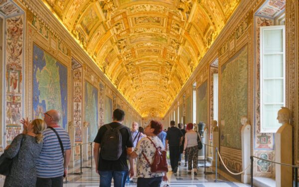 Explore the ornate and golden ceilings of the Vatican Museums filled with art and history.