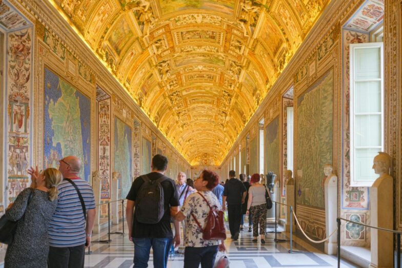Explore the ornate and golden ceilings of the Vatican Museums filled with art and history.