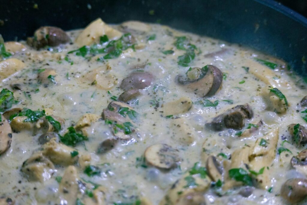 Delicious creamy mushroom sauteed in a savory garlic sauce, garnished with fresh herbs.