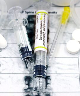 Close-up of syringes and pills on a bone density exam sheet, depicting osteoporosis treatment.