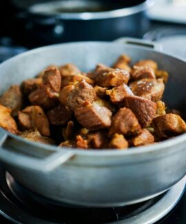 Hearty cooked meat pieces in a pot, perfect for home-cooked meals.