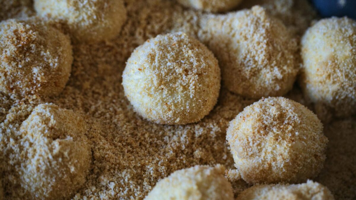 Delicious breadcrumb-coated dumplings ready for cooking, showcasing texture and flavor.