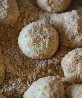 Delicious breadcrumb-coated dumplings ready for cooking, showcasing texture and flavor.