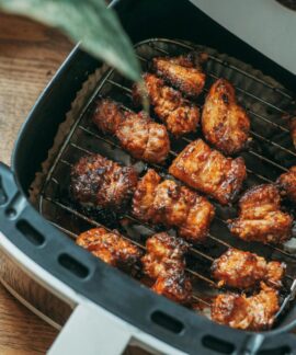 Delicious crispy chicken pieces cooked perfectly in a modern air fryer, ready to serve.