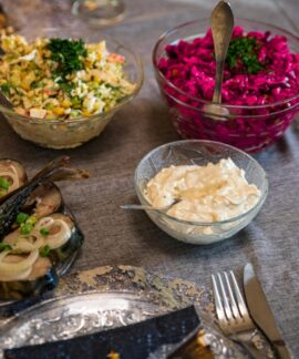 An elegant table setup with diverse salads and appetizers, perfect for a gourmet meal.