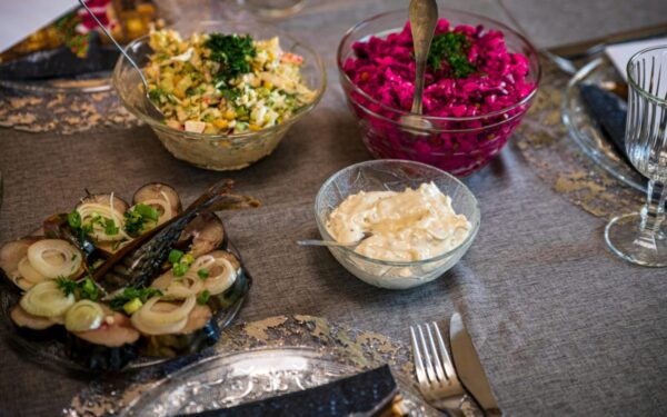 An elegant table setup with diverse salads and appetizers, perfect for a gourmet meal.