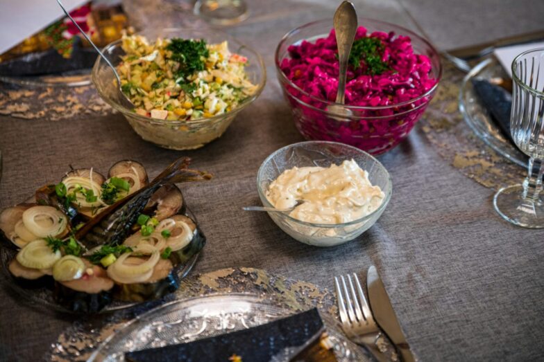 An elegant table setup with diverse salads and appetizers, perfect for a gourmet meal.