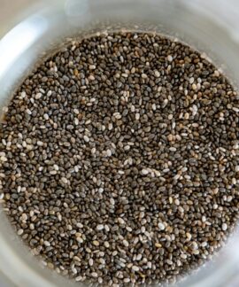 High-angle view of chia seeds in a glass jar, perfect for healthy cooking.