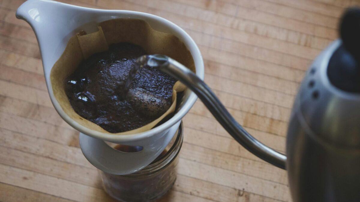 Close-up of freshly brewed pour over coffee on a wooden countertop.