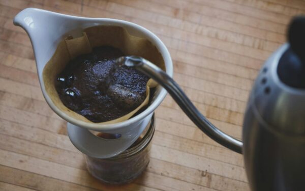 Close-up of freshly brewed pour over coffee on a wooden countertop.