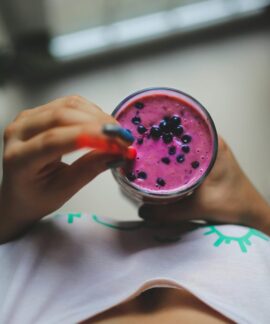 Enjoy a healthy and vibrant blueberry yogurt smoothie with a pop of color, perfect for a nutritious lifestyle.