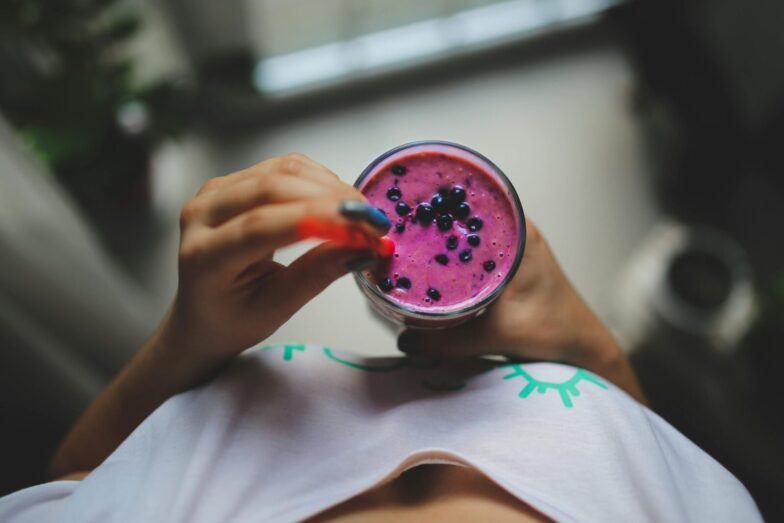 Enjoy a healthy and vibrant blueberry yogurt smoothie with a pop of color, perfect for a nutritious lifestyle.