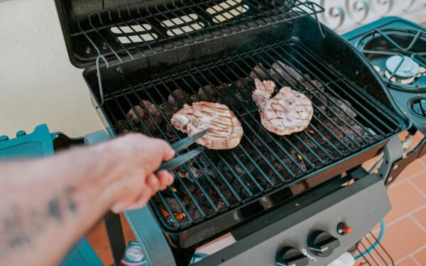 Close-up of two steaks grilled on a barbecue in Sardegna, Italy.
