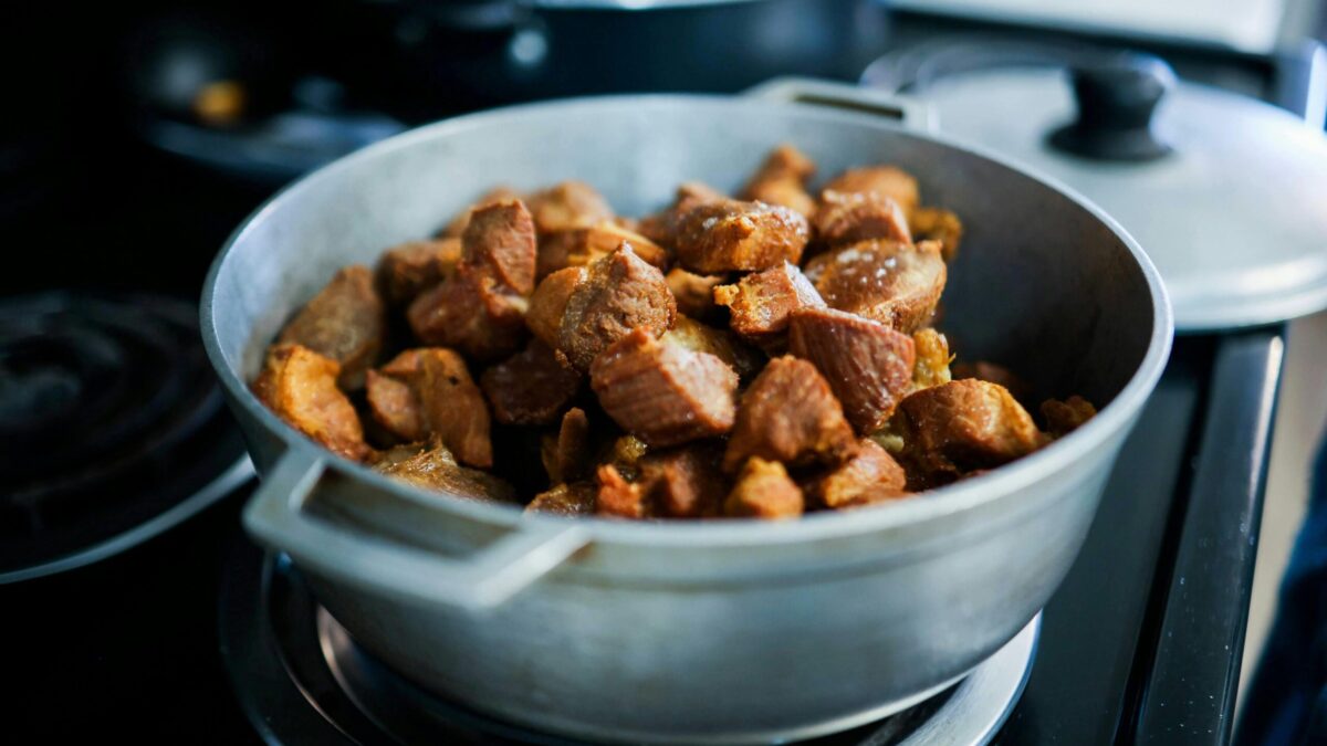 Hearty cooked meat pieces in a pot, perfect for home-cooked meals.