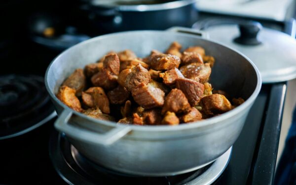 Hearty cooked meat pieces in a pot, perfect for home-cooked meals.