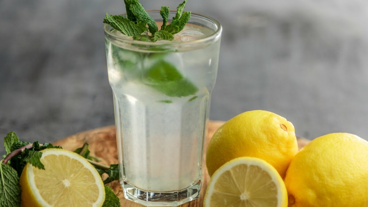 lime juice on drinking glass beside sliced limes