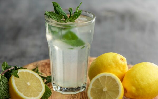 lime juice on drinking glass beside sliced limes