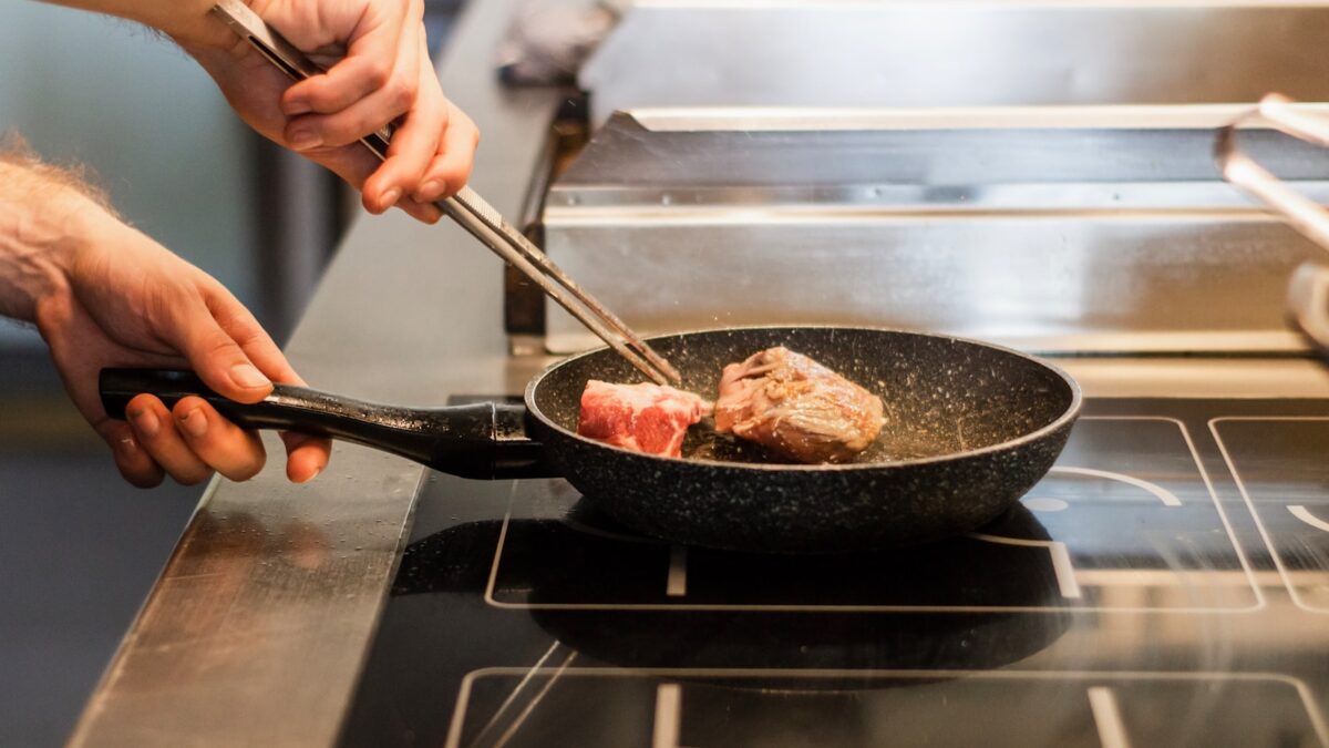 unknown person frying meat