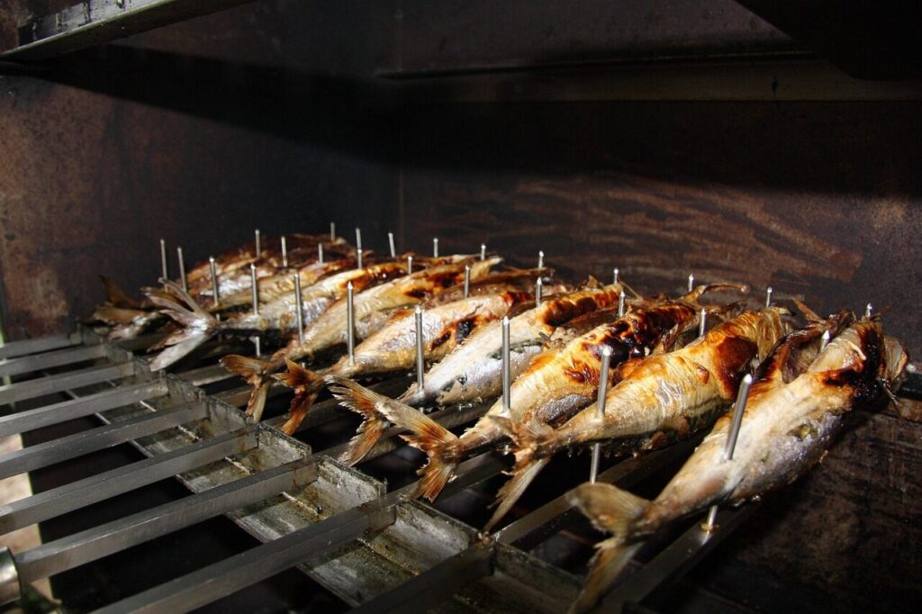mackerel, steckerlfisch, fish, meal, enjoyment, food, grill, fire, nourishment, smoked fish, fish preparation, charcoal, nature, smoked, specialty
