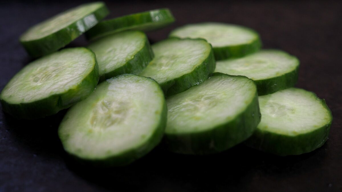 sliced cucumber on brown wooden table