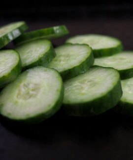 sliced cucumber on brown wooden table