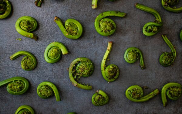 green chili peppers on gray surface