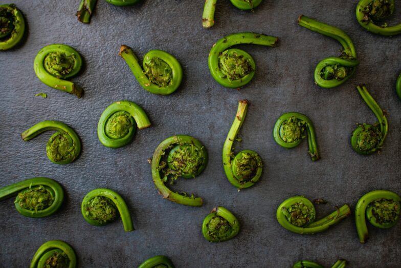 green chili peppers on gray surface