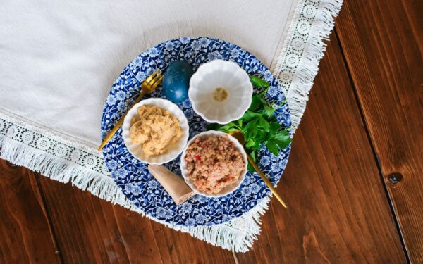 Easter eggs and dips on a decorative plate