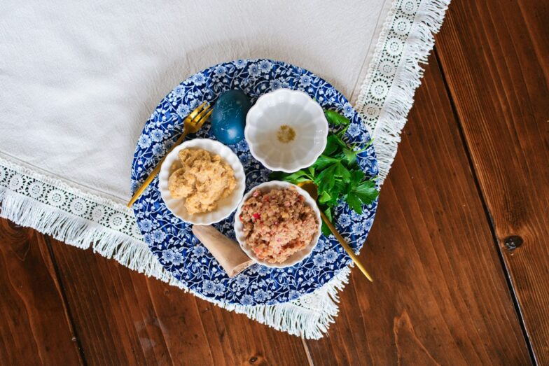 Easter eggs and dips on a decorative plate