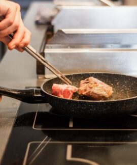 unknown person frying meat
