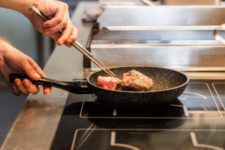 unknown person frying meat