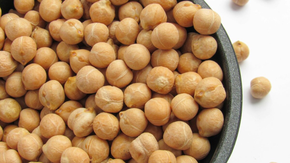 a bowl filled with chickpeas sitting on top of a table