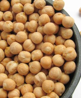 a bowl filled with chickpeas sitting on top of a table