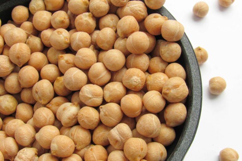 a bowl filled with chickpeas sitting on top of a table