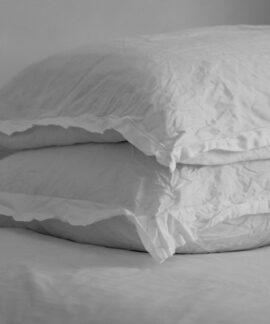 white bed pillow on bed