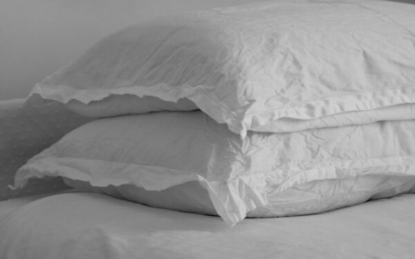 white bed pillow on bed