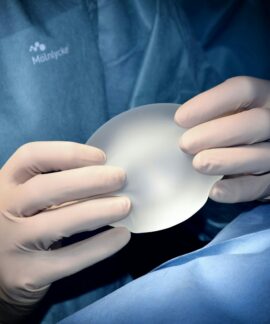 person holding white heart shaped ornament