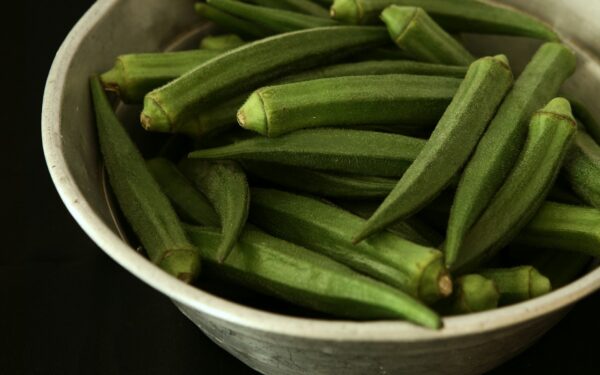 Okra vegetable in white bowl