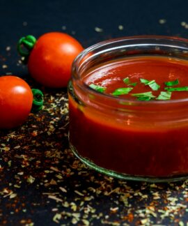 tomato and tomato puree with parsley in bowl