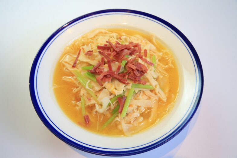soup in white and blue ceramic bowl