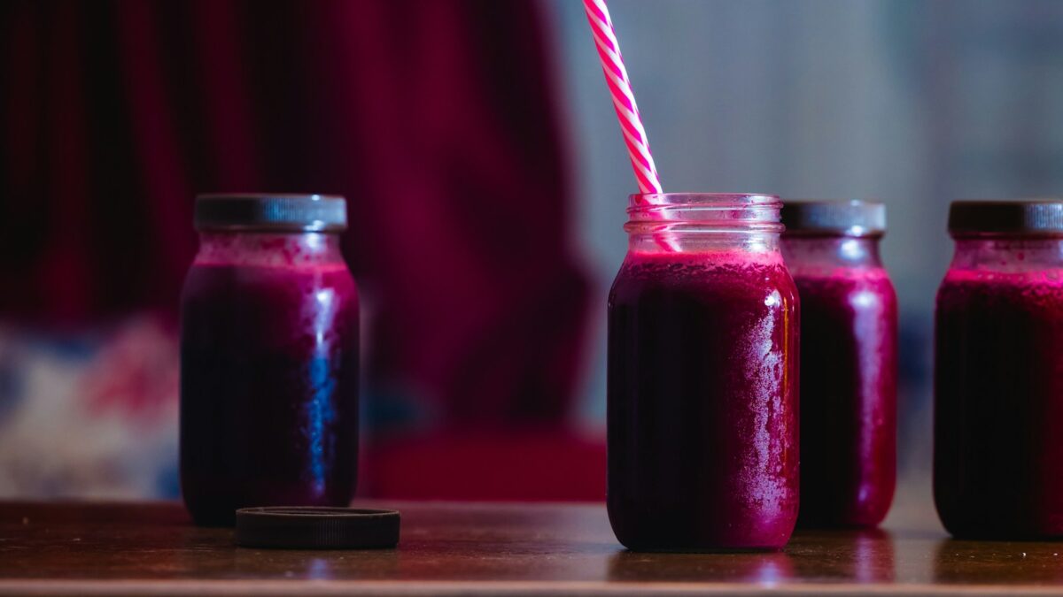 red beverage in mason jars