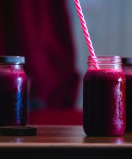 red beverage in mason jars