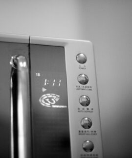 a black and white photo of a microwave