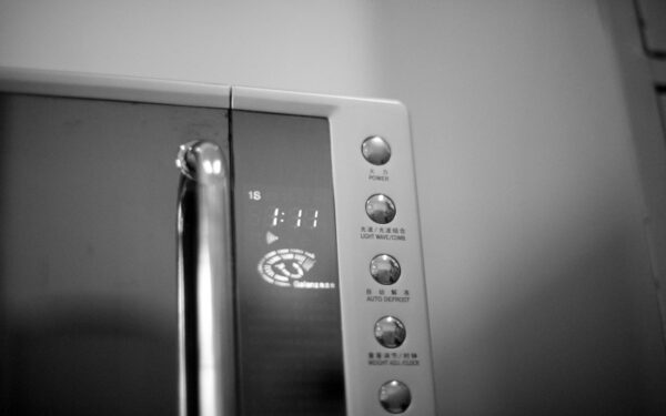 a black and white photo of a microwave