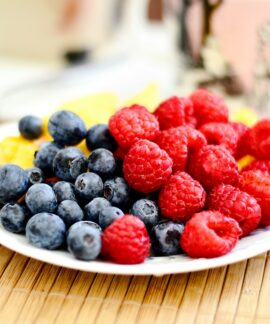 strawberries and blue berries on palte