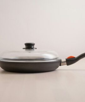 a pan with a lid on a table