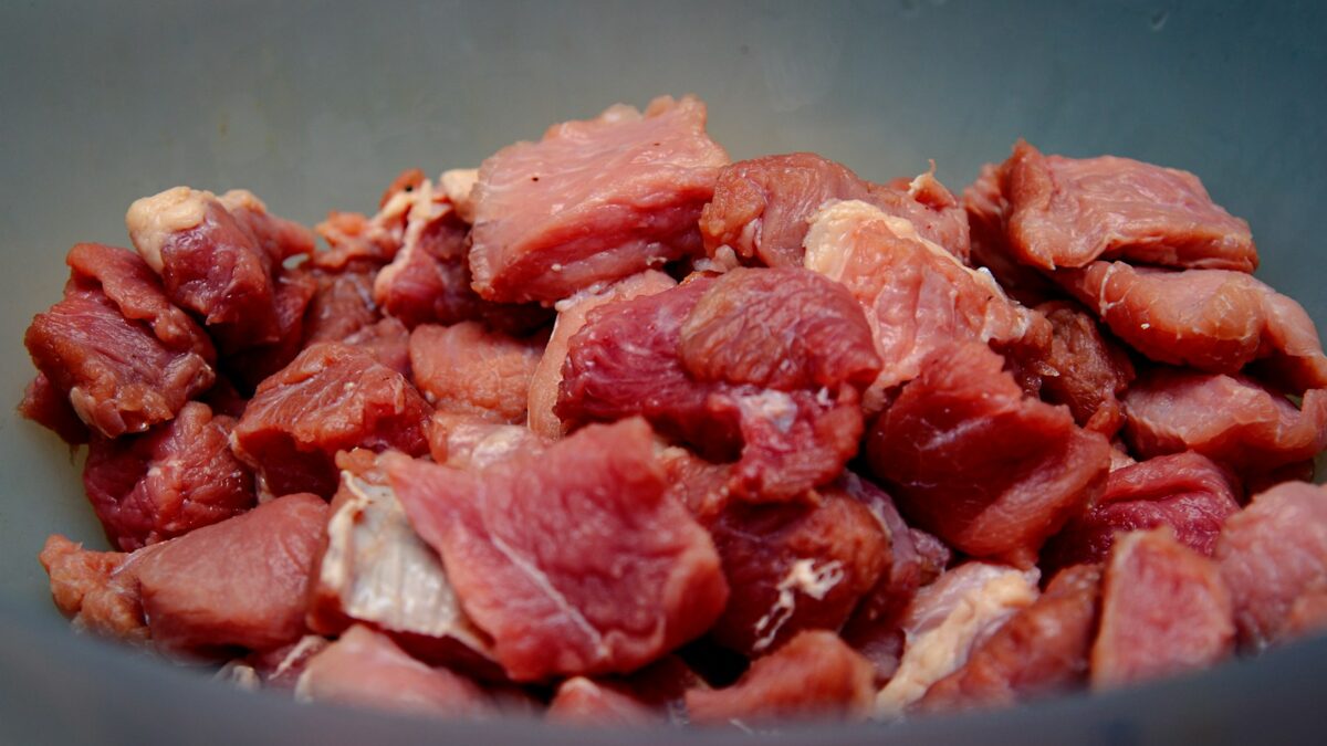 raw meat on blue ceramic bowl